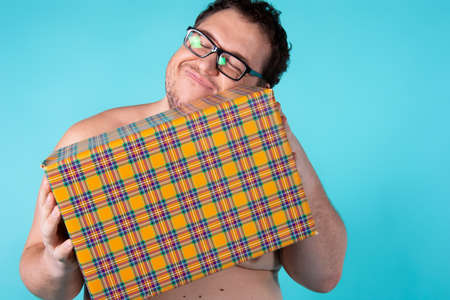 Funny fat man and gift.の写真素材