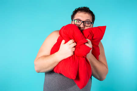 Funny fat man wakes up in the morning.の写真素材