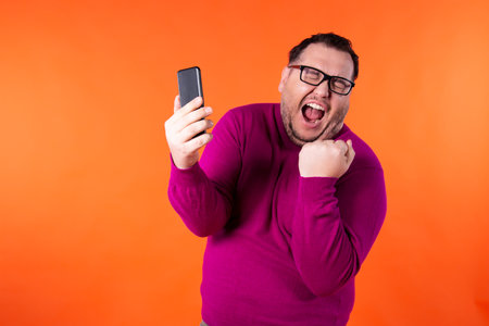 Adult attractive man on a colored background. Business and work.の写真素材