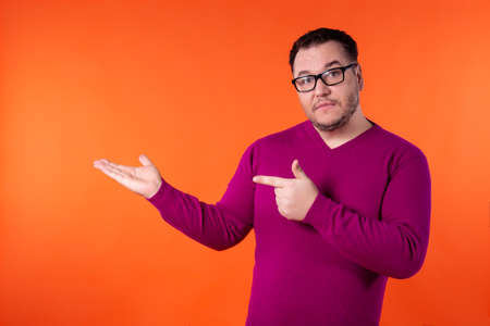 Adult attractive man on a colored background. Business and work.の写真素材