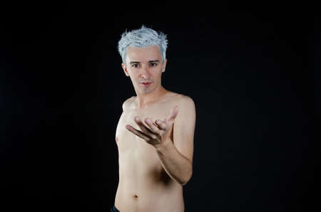 Young attractive guy. Black background.の写真素材