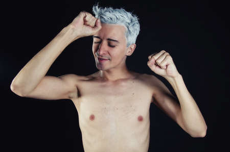 Young attractive guy. Black background.の写真素材