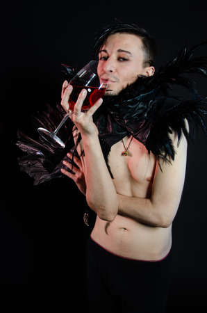 Halloween and art. An attractive guy. Black background.の写真素材