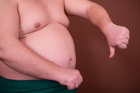 Diet and weight problem. A man with a big belly.の写真素材