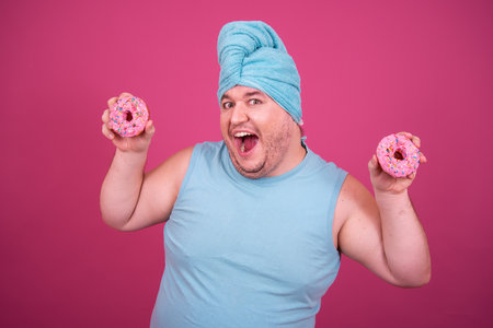 Funny fat man eats donuts. Retro style. Food and fitness.の写真素材
