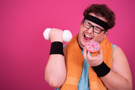 Funny fat man eats donuts. Retro style. Food and fitness.の写真素材