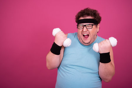 Funny fat man eats donuts. Retro style. Food and fitness.の写真素材