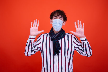 Young attractive guy with a flag posing in the studio.の写真素材