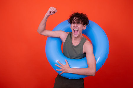 Funny guy with an inflatable ring. Vacation and holidays.