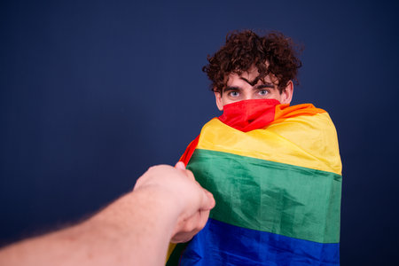 Young man with curly hair and a flag of Mauritius in his face.の写真素材
