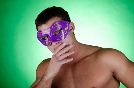 Young handsome man with athletic body posing in the studio. Sports and healthy lifestyle.の写真素材