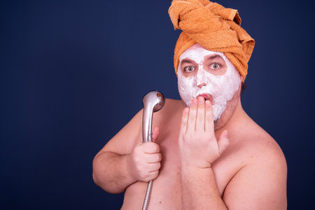 Funny fat man sings in the shower.の写真素材