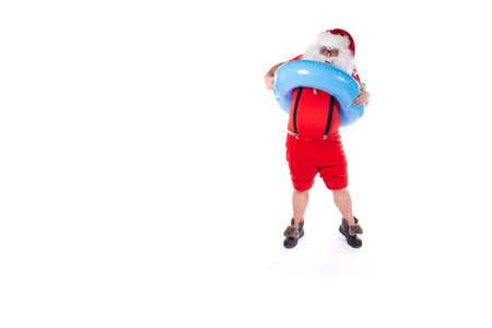 Santa Claus holding a lifebuoy and looking at the camera, isolated on white background