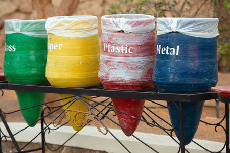Four decorative trash bins in the form of vases for sorting of waste. The concept as it is possible...