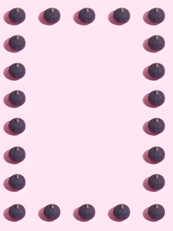 Colorful fruit pattern of fresh figs on purple pastel background, top view, flat lay