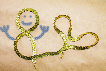 March 8. Funny stylization of a mermaid from decorative tape on the brown background.の写真素材