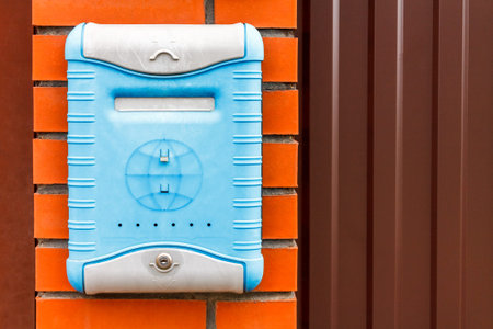 A beautiful mailbox hangs waiting for newspapers, parcels and letters from friends.