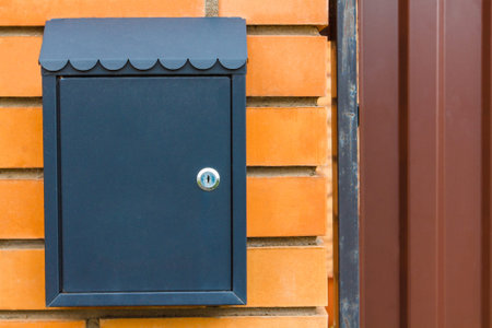 A beautiful mailbox hangs waiting for newspapers, parcels and letters from friends.