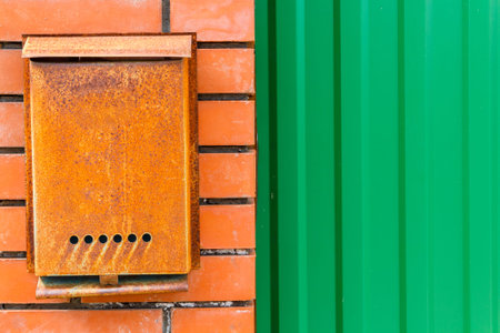 A beautiful mailbox hangs waiting for newspapers, parcels and letters from friends.