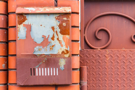 A beautiful mailbox hangs waiting for newspapers, parcels and letters from friends.