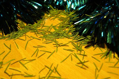 Bright and shiny decorations for Christmas and New Year hang on a green spruce. Winter holidays.の写真素材