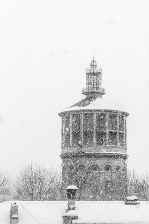 snowing over the towerの写真素材