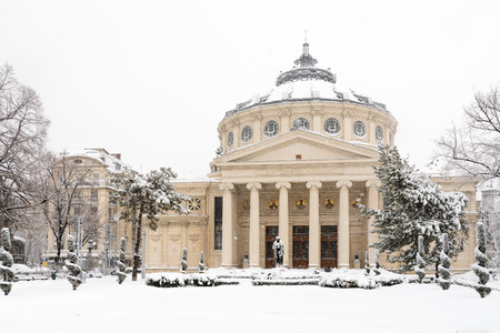 Bucharest, Romania - January 17: University Square on January 17, 2016 in Bucharest, Romania. The Romanian Athenaeum George Enescu Ateneul Roman opened in 1888 is a concert hall in the center of Bucharest and a landmark of the Romanian capital city.のeditorial素材