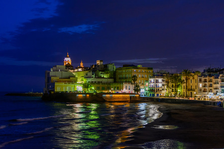 Sitges, Spain - June 10: Illuminated sea shore and buildings on June 6, 2016 in Sitges, Spain. This coastal city in Catalonia is famous for its Film Festival and Carnival.の写真素材