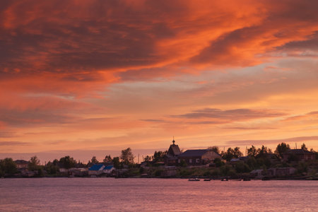 Beautiful sunset sky and clouds after a thunderstorm. Village Rabocheostrovsk, Republic of Karelia, Russia, the coast of the White Seaの写真素材