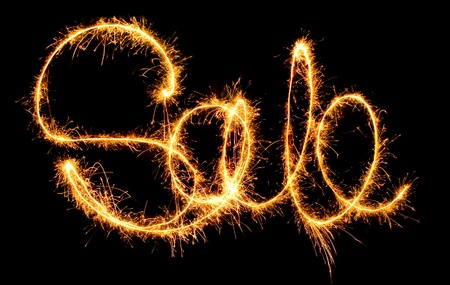 sparkling inscription of "sale" on a black backgroundの写真素材
