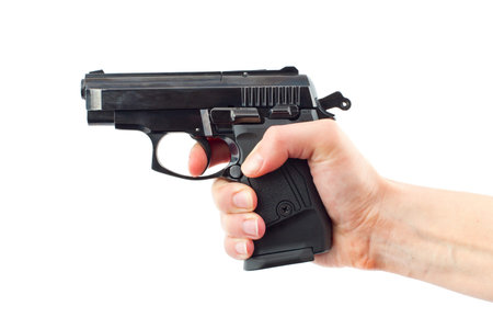 Hand with gun on white. Isolated