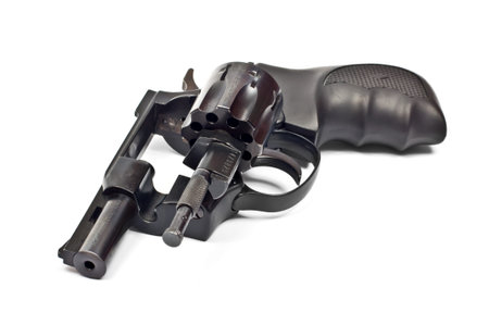 Black revolver gun isolated on white background