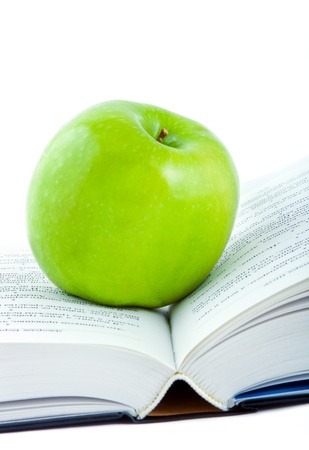 An green apple on bookの写真素材