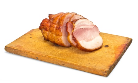 Bacon slices on a cutting board. On white backgroundの写真素材