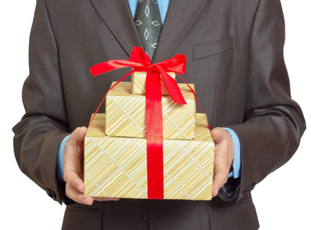 Businessman present gift box with red  ribbon bow, front view, isolated over white background