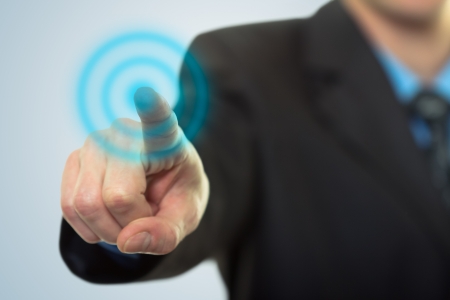 Businessman pressing button on touch screen technologyの写真素材