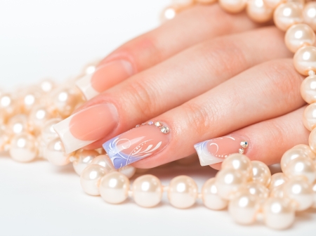 Beautiful female hands with french manicure closeupの写真素材
