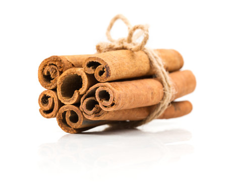 Beam cinnamon roped on a white background with reflection