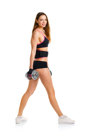Happy athletic woman with dumbbells doing sport exercise, isolated on white backgroundの写真素材