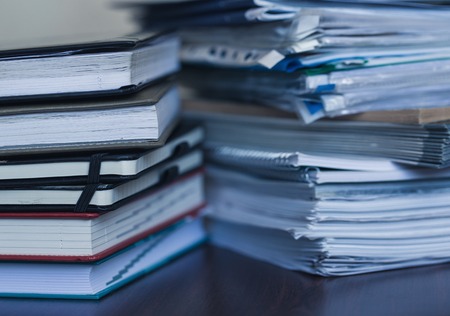 Accounting and taxes. Large pile of magazine and books closeupの写真素材