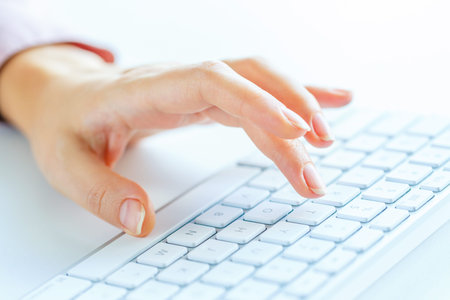 Female hands or woman office worker typing on the keyboard