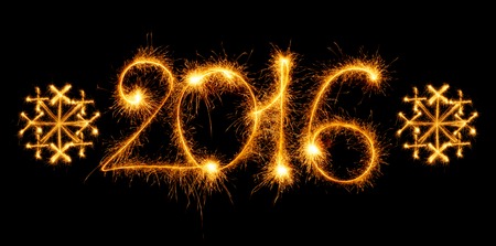Happy New Year - 2016 with snowflakes made by sparklers on black backgroundの写真素材