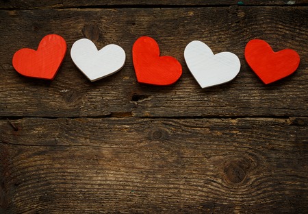 Red and white hearts on old shabby wooden background. Image of Valentines dayの写真素材