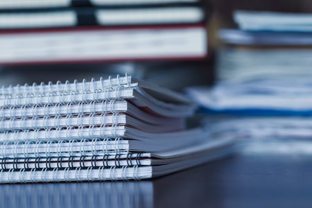 Accounting and taxes. Large pile of magazine, notebook and books closeup