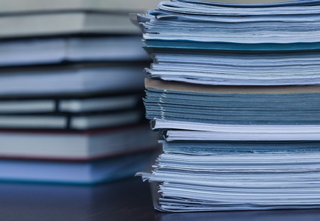 Accounting and taxes. Large pile of magazine and books closeupの写真素材