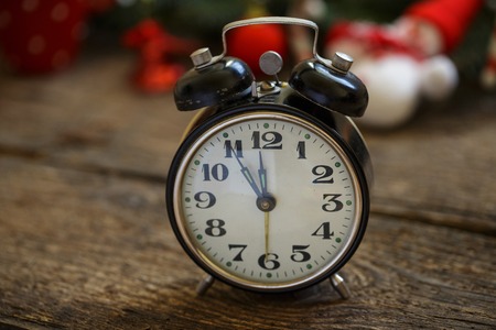 Vintage alarm clock on christmas backgroundの写真素材