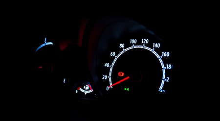 Speedometer illuminated at night close upの写真素材