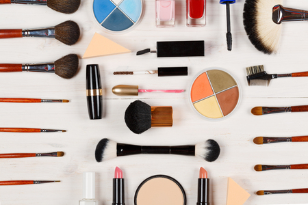 Various makeup products on white wooden backgroundの写真素材