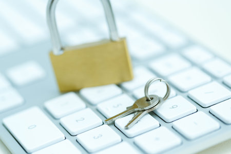 Security lock on white computer keyboard - computer security breach conceptの写真素材
