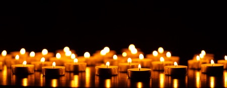 Many burning candles with shallow depth of field - peace conceptの写真素材